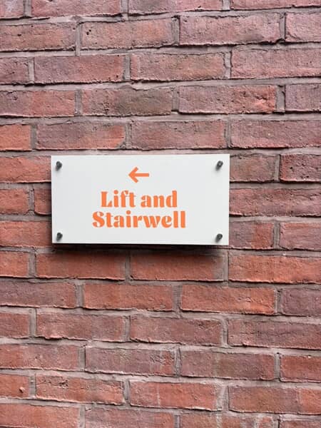 An image of the lift and stairwell wayfinding signage.
